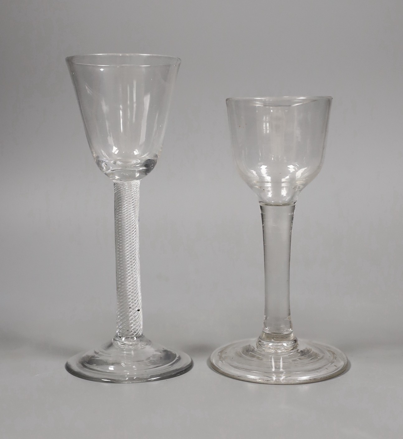 An 18th century air twist cordial glass and a plain stem cordial glass, tallest 16cm